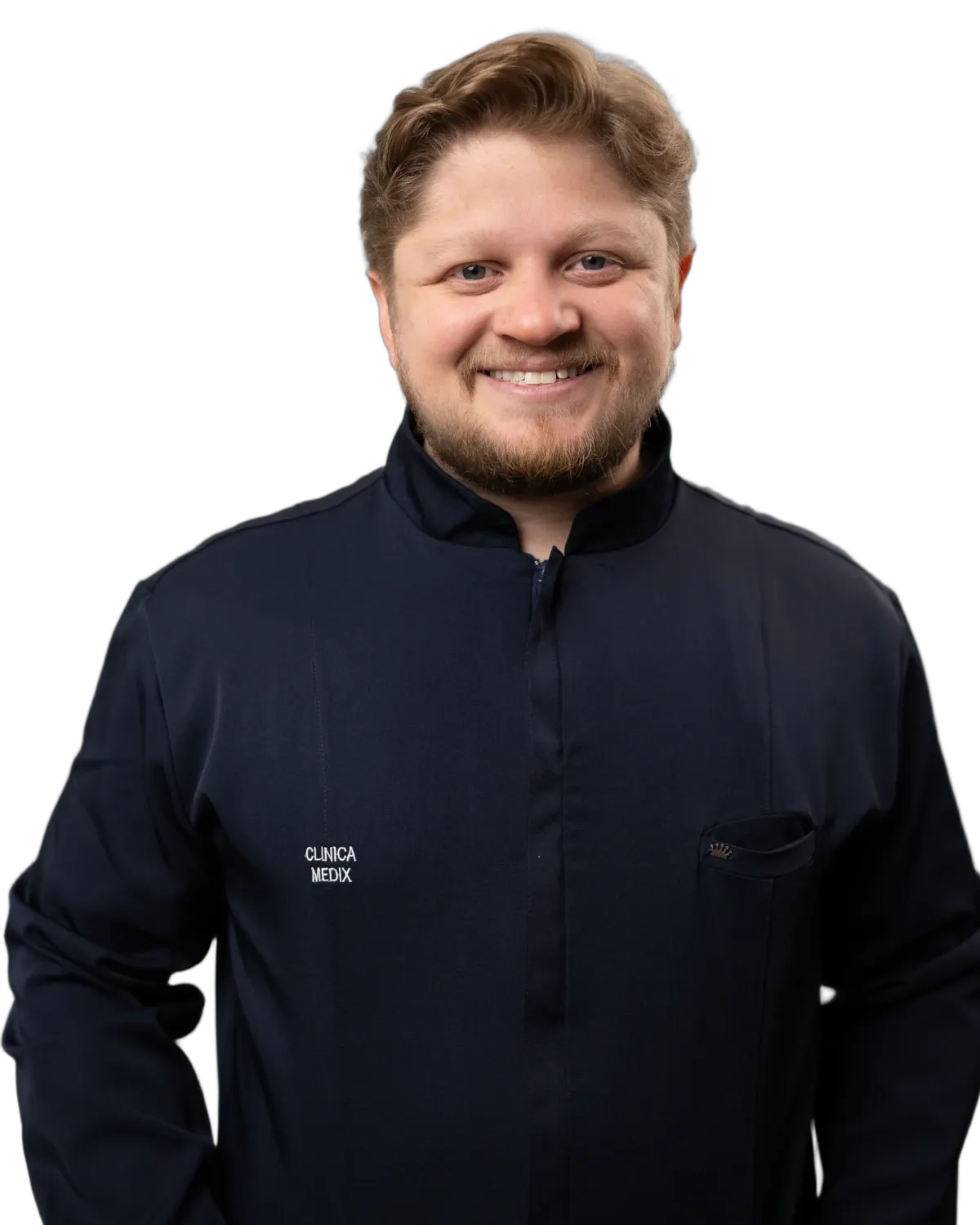 Dr. Yuri Vasques, ginecologista, sorrindo de jaleco azul-marinho